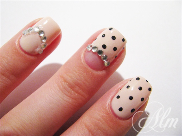 Add some silver diamonds ^^ Making a half moon shape our one nail ^^