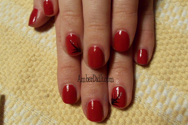 Simple red with flourish accent nails