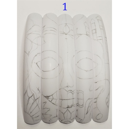 1. To create this look stick 5 extra long white nail tips of similar size using nail glue and buff the surface lightly. Sketch the design with a pencil to outline the main elements of the mural.