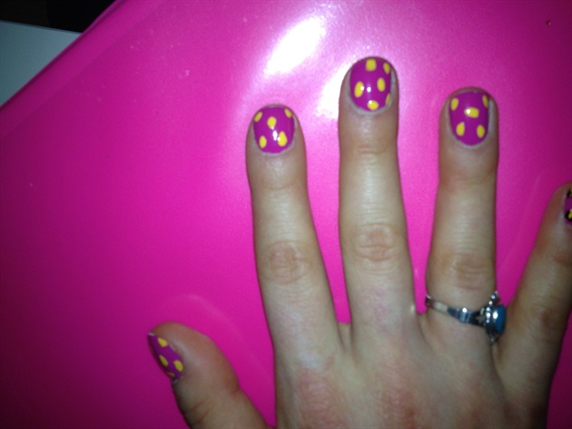 Next, use a small dotter to add dots in a different color in a random pattern across all nails.