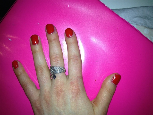 First, paint a clear base coat and two coats of bright red polish.