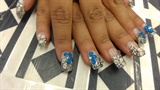 silver gitter nails with blue flowers
