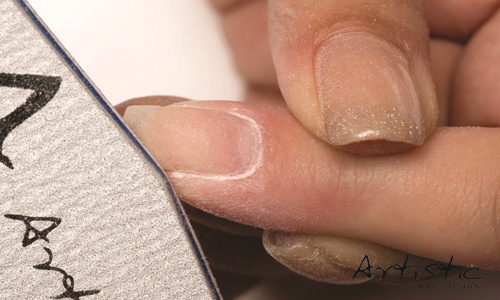 Remove the inhibition layer with Artistic Nail Surface Cleanser using a lint-free wipe and file to the desired length and shape with an Artistic 180-grit Aspect File. 