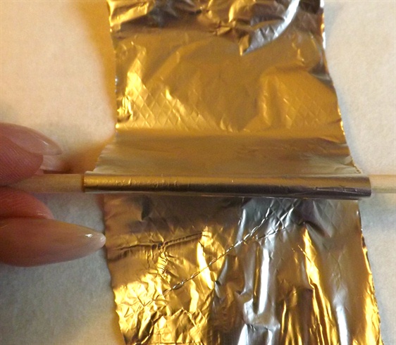 Roll a small strip of foil around a thin orangewood stick. Remove carefully to retain shape.