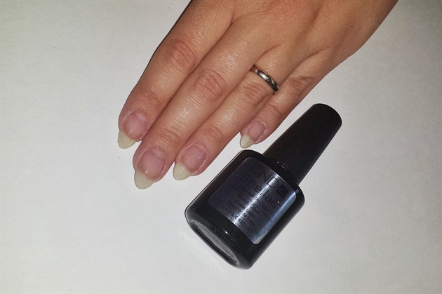 After performing a manicure, apply a thin coat of soak-off gel base coat. 