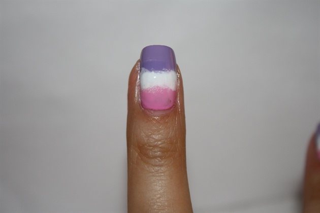 Sponge the white onto the middle of your nail, apply top coat, and clean your cuticles.
