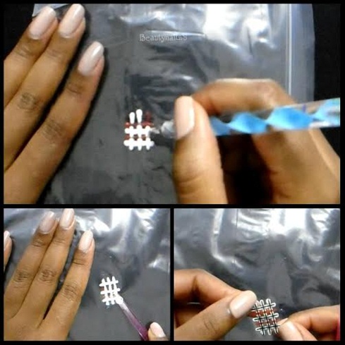 -Fill in the stripes with white nail polish and red  nail polish.\nWhen completed, let it dry for about 40mins\n-Remove it from the bag by using nail stick.