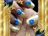 Gold Nail Art With Blue Flowers 