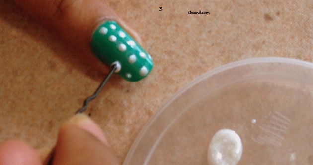 Pour few drops of color on plate or plastic sheet,bend the bobby pin to make it straight  and dip the round end of bobby pin each time into the polish to make dots on nail .Make sure the dots are of similar size and wait for the dots to dry.