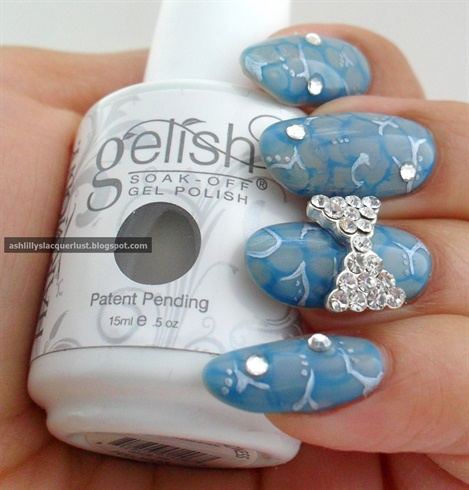Gelish: Marbled croc nails and bows. 