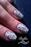 Gray nail art with splatter like design 