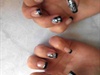 Black french manicure with silver flower