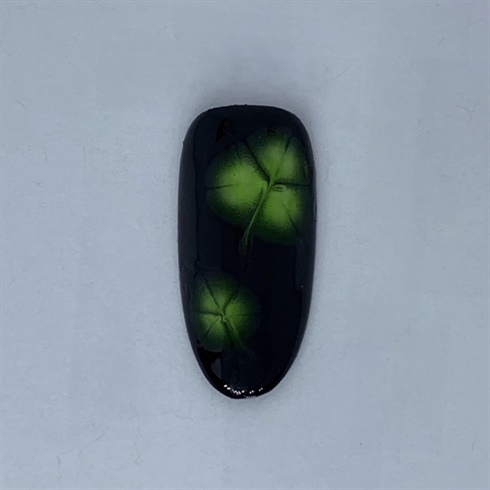 Coat each bloomed shamrock with a thin layer of green glass gel. Cure for 30 seconds.