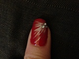 Close up red design on thumb