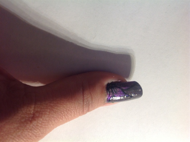purple flower on metal thumb
