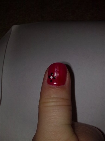red nail with black flower