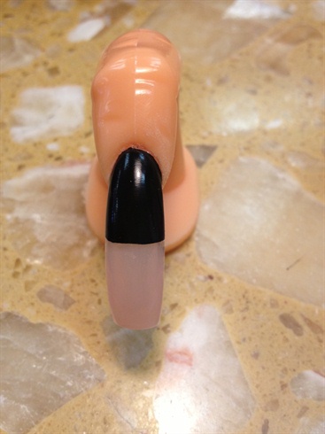 Paint clear polish onto bottom half of the nail.