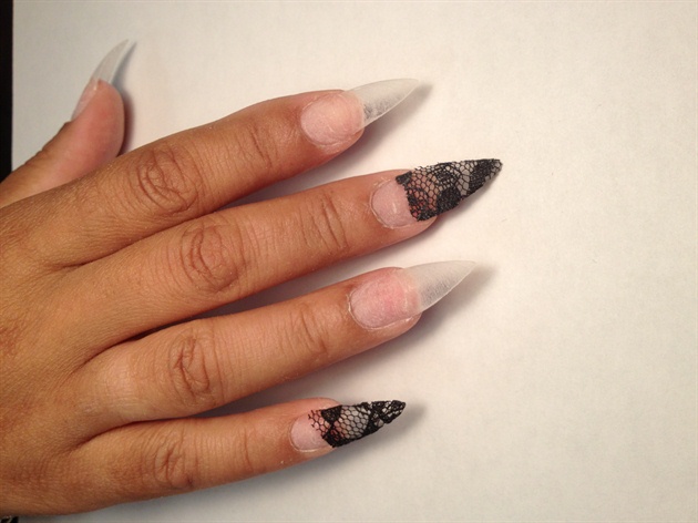 Cut off the excess lace, then began to encapsulate the lace with a gel overlay. Its best to use clear nails so the design can appear transparent.  