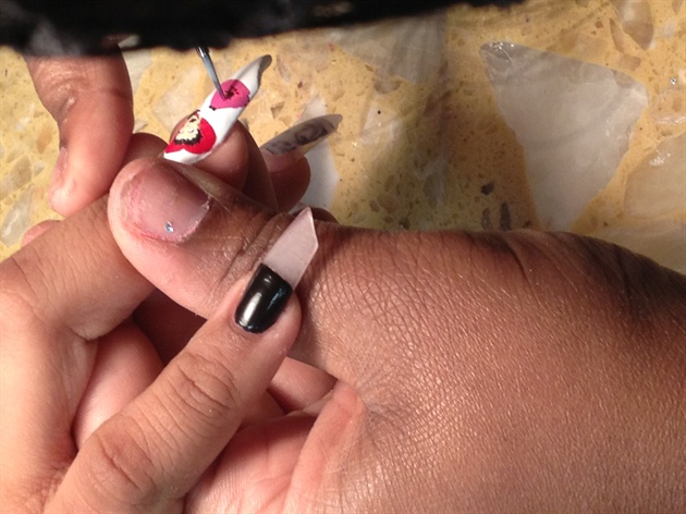 Hand paint art in desired places onto the nails.