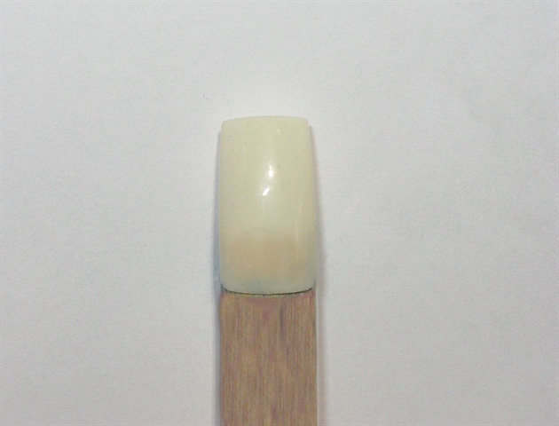Paint the nail a buff/nude color using gel polish.  Cure, and wipe off tacky layer.