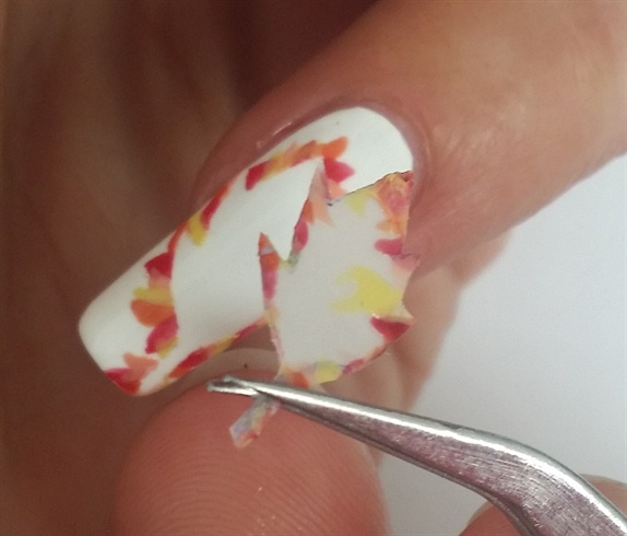 Use the tweezers or your nails to remove the stickers from your nails.