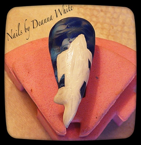 Wipe off dispersion layer and paint on the gold fish shape in white gel polish. Full cure.