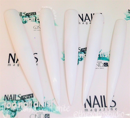 I apply 2 coats of white gel polish. I remove the dispersion layer with alcohol and then I give them a gentle buffing. 