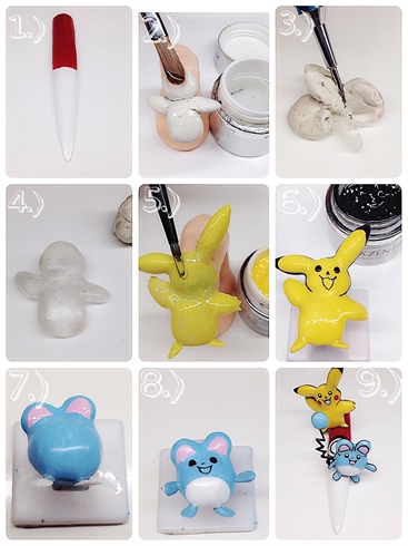  1.) Catch them all! Team blue forever! I start with a nail painted with white gel polish. Then I paint the other half with red gel paint and cure. 2.) I build the shape of Pikachu out of clay then I apply cuticle oil for easy removal and coat with gel. Cure. 3.) I can now remove clay in one piece, I use a metal stylus to dig it out. 4.) As you can see it comes out very clean.  5.) I add on some ears the same way and then paint him with yellow gel play. Cure. 6.) I stay outlining him with Gel Play and painting his face. 7.) I build Pikablu the same way and paint him with blue gel. I also make little feet and hand for him with gel. 8.) I paint his belly white and paint his face and glue on his tail. I finish the critters with top gloss. 9.) I finish up the details on the pokeball nail and top gloss it. Then I apply the Pokemon with jewelry gel and cure. 