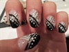 Black and White nails with silver lines.