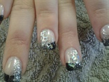 Black french with glitter and stars.