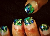 Peacock feather swirled nail art