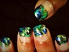 Peacock feather swirled nail art