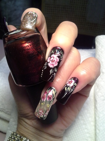 Brown nails with flowers.