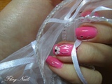 Pink manicure with white flowers