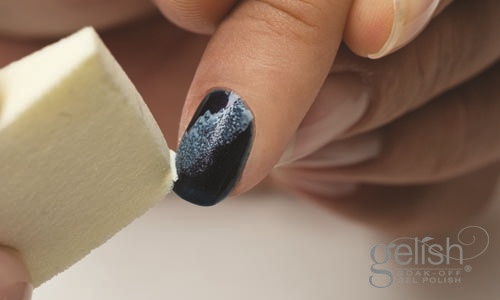 Using a triangle make-up sponge, sponge in the Gelish Soak Off Gel Polish “ Sheek White” diagonal into the middle of the nail plate. Cure under LED 18G light for 30 seconds or 2 minute under UV light.