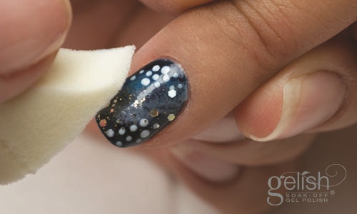 Using the make-up sponge, sponge in Gelish Soak Off Gel Polish “ Grand Jewels” to the nail. Cure under the LED 18G in 20 seconds or 1 minute under UV light.