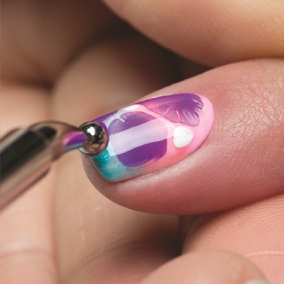 Apply a thin coat of Simple Sheer (Clear) to the entire surface of the nail. While the nail is still wet, using the dotting tool, drop couple dots of You Glare, I Glow (Purple) to random spots on the nail. Then add couple dots of Arctic Freeze (White) to other areas on the nail.