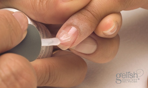 Apply a thin coat of Gelish Foundation Base Gel to the entire nail and cap the free edge. Cure in the Gelish 18G LED Light for 5 seconds or 1 minute in a 36-watt UV lamp.