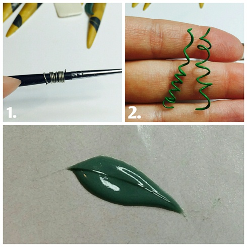 Here I twisted some wire and painted it with green gel polish to look like coils of a jungle vine.\nI also made some 3d leaves with my Akzentz gel mixed with green gel polish.