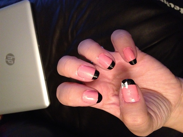 Pink nails with black tips and whitebow 