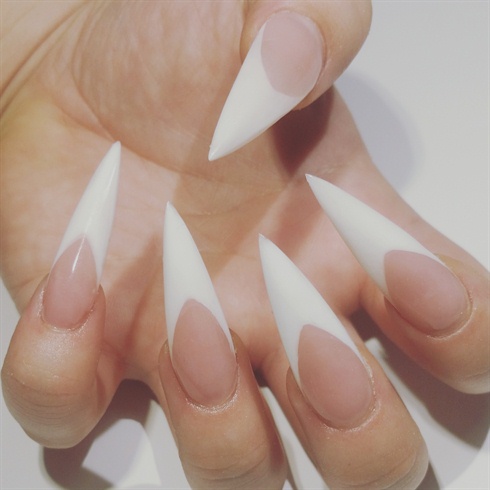 After buffing, brush off dust and wipe the nails with alcohol or a nail cleanser to remove any excess debris and oils. Then, apply gel top coat and cure, and don't forget the cuticle oil on the eponychium and hyponichium . & there you have it ! Beautiful sculpted pink and white acrylic nails !