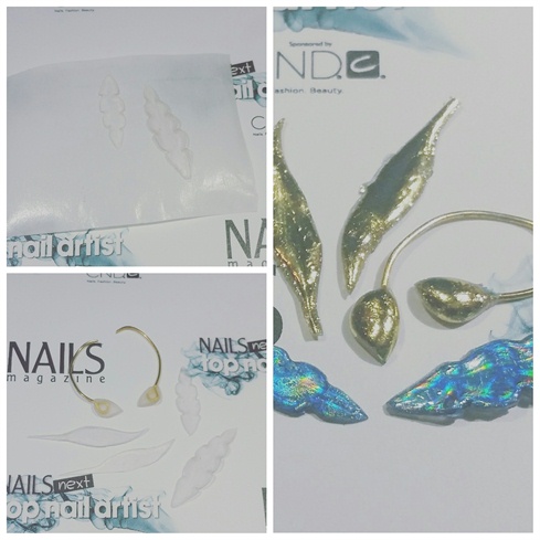 Then, i sculpted feathers and leaf shapes with acrylic, and applied nail foil.