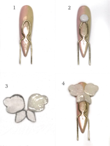 1. Bend wire into a U-shaped hairpin. Attach to nail with Bling On, cure.\n2. Using the same Gel Art Powder mixture, place a bead on the nail at the top of the hairpin, the butterfly wings will cure into this.\n3. On a piece of paper, draw a stencil of the butterfly wings. Cover the paper with plastic, and use as a guideline for the wings. Sculpt and cure.\n4. Stick wings into uncured gel and cure.\n