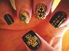 black and gold cheetah nails