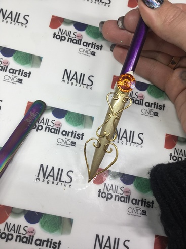 Then I attached my shapes with a tweezer and gel and applied a huge swarovski in the amazing color Astral Pink in the top of the nail, applied using gel
