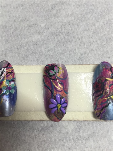The flower and other decorations i had added looked a little flat and blended into the background so I decided to go back in with gel polish over my embellishments to give them a little more depth. I figured it would make them stand out better. 