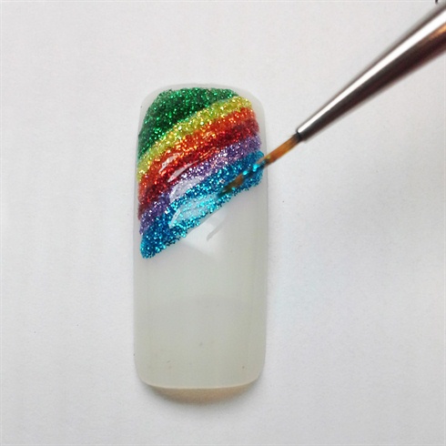 Apply glitter gel in a rainbow pattern over the top of the nail and cure.