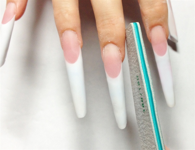Sculpt French Pipe shaped nails with Acrylic. Pipe Shape is pointy in shape, but keeps the deeps C curve like Square nails. File the free edge of the nail at a 45 degree angle for a pointy view from above.