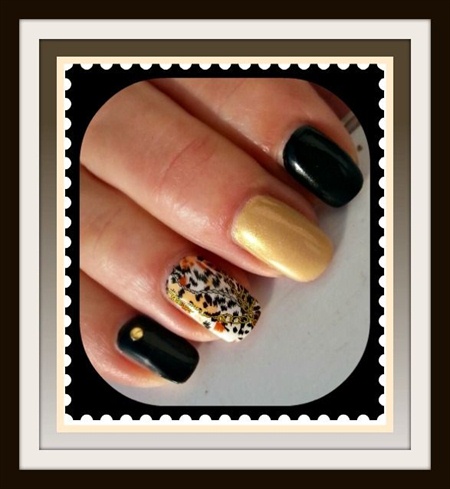 Black, gold and animal nail art