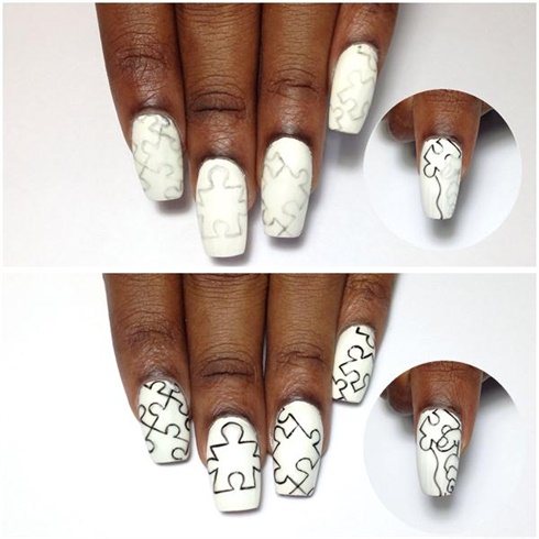 On gently buffed white gel nails, lightly draw a rough sketch of the puzzle pieces. Outline using a black nail art polish brush.  